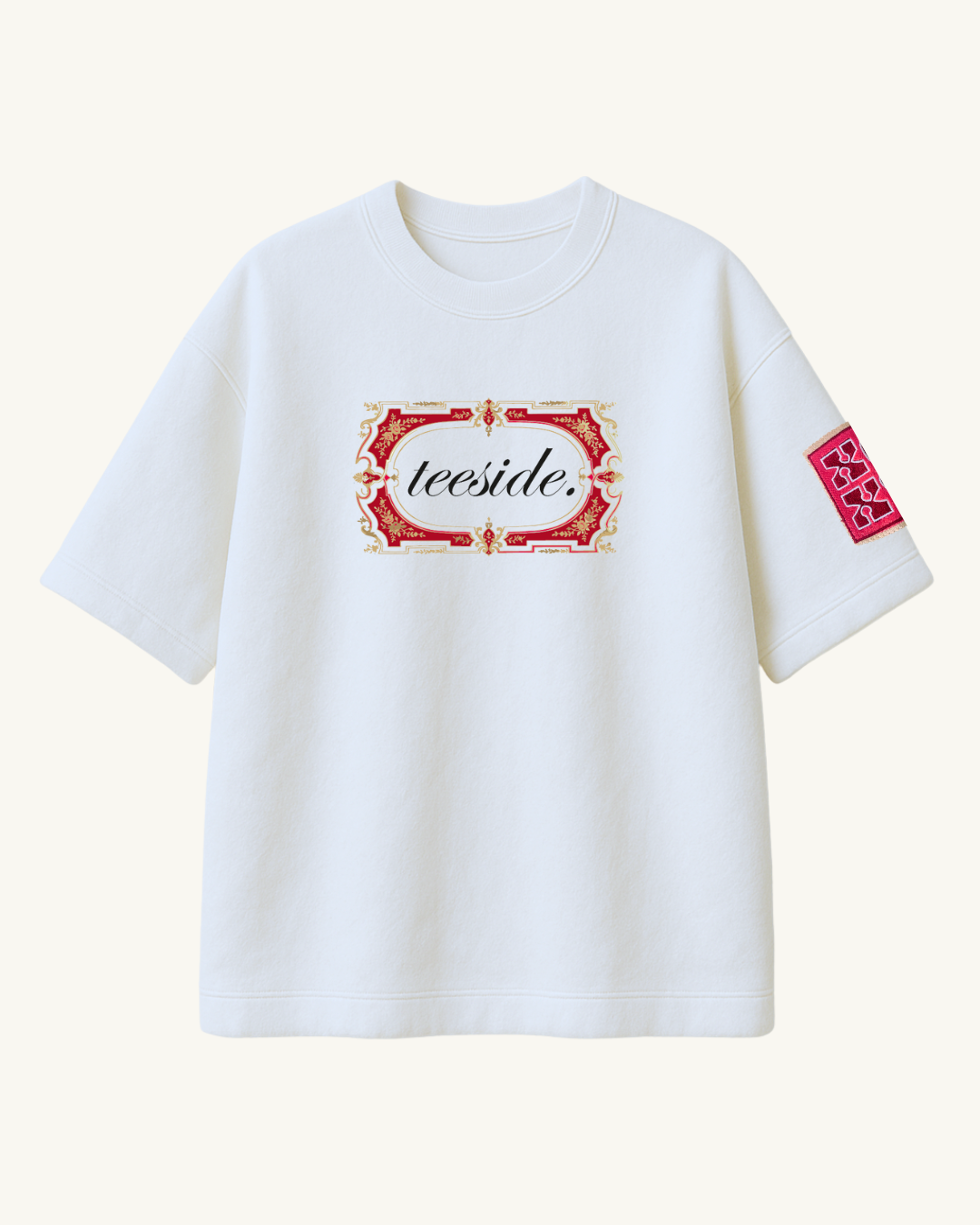 White t-shirt with ornate red and gold frame, teeside logo, and sleeve patch design