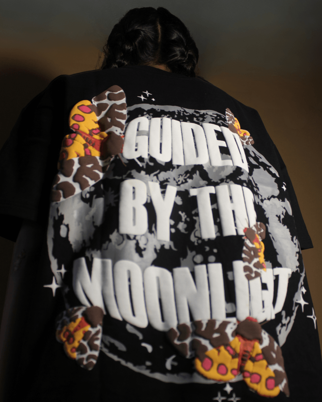 teeside graphic tee with 'Guided By The Moonlight' text, moon design, and colorful moths