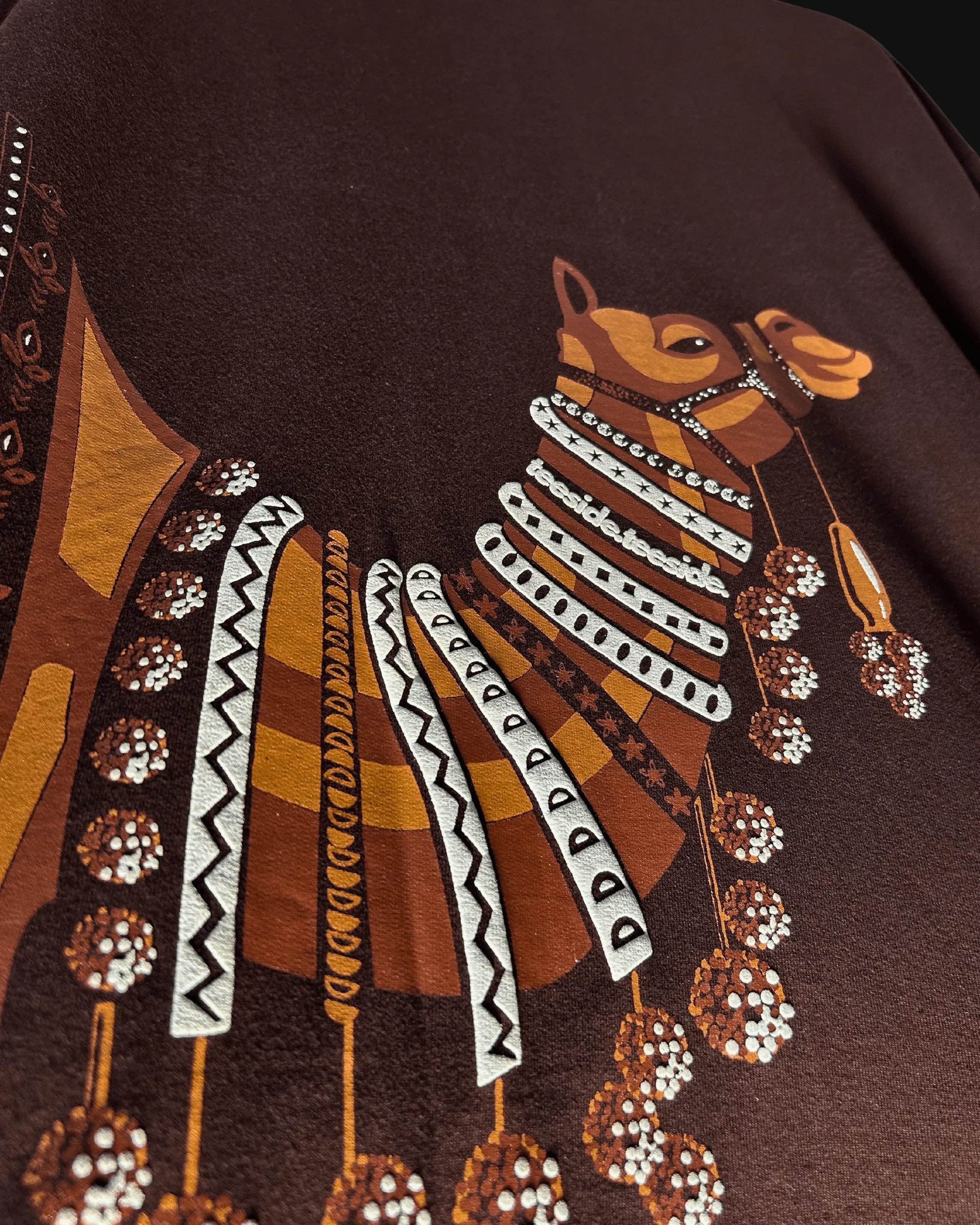 teeside brown t-shirt with intricate camel graphic and decorative patterns