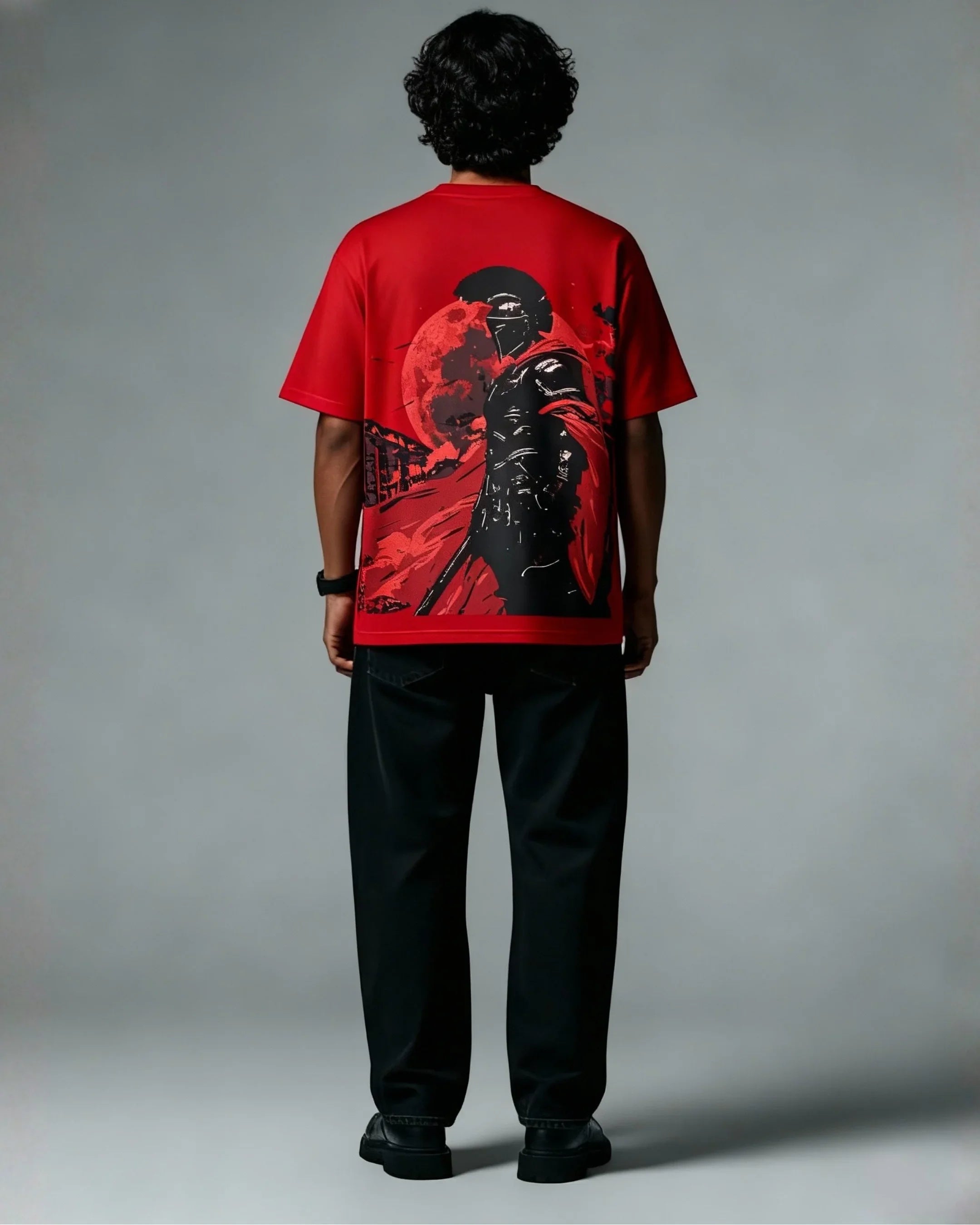 Man wearing teeside red graphic t-shirt featuring a warrior and full moon design