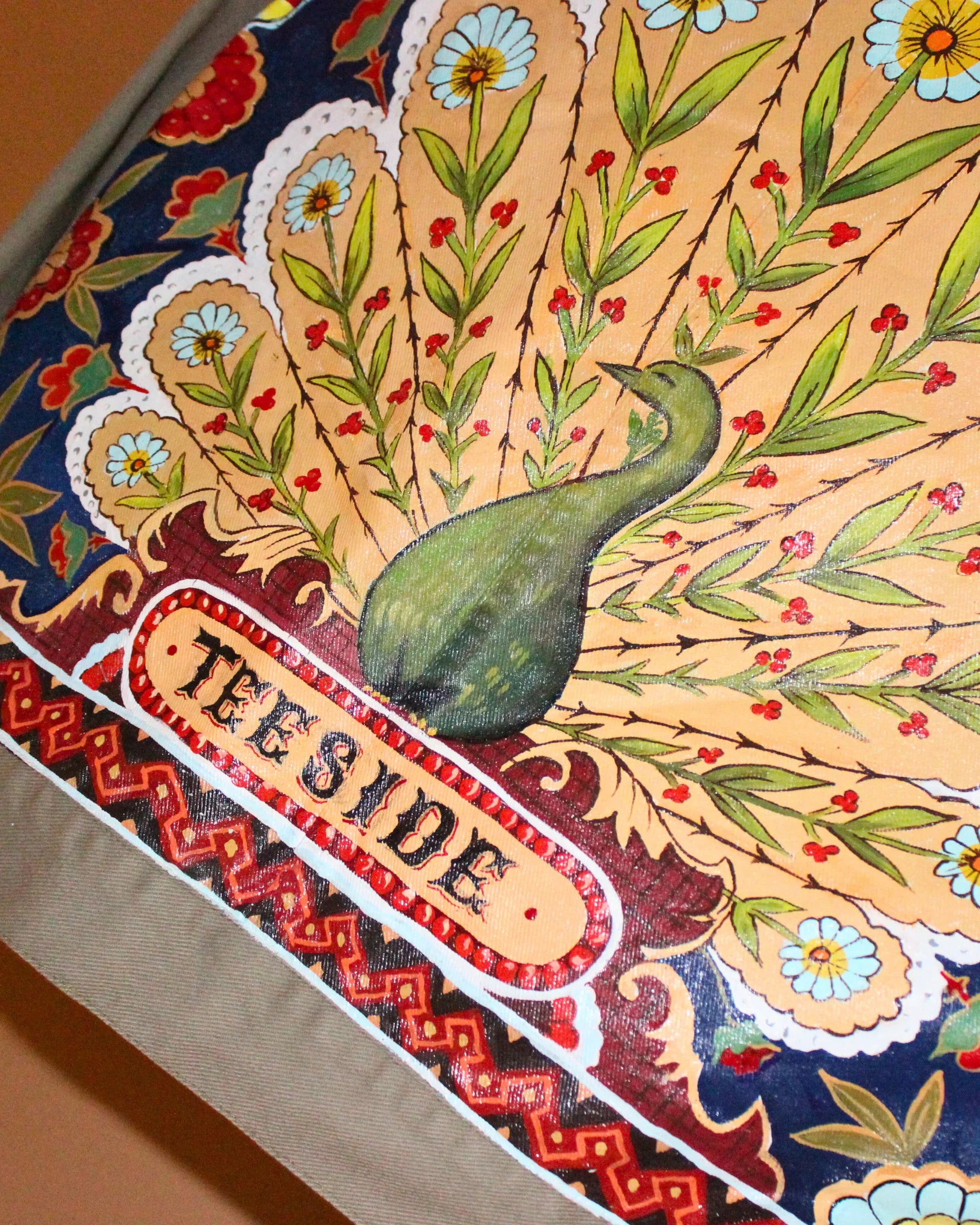 teeside peacock illustration with floral and ornate patterns on colorful fabric