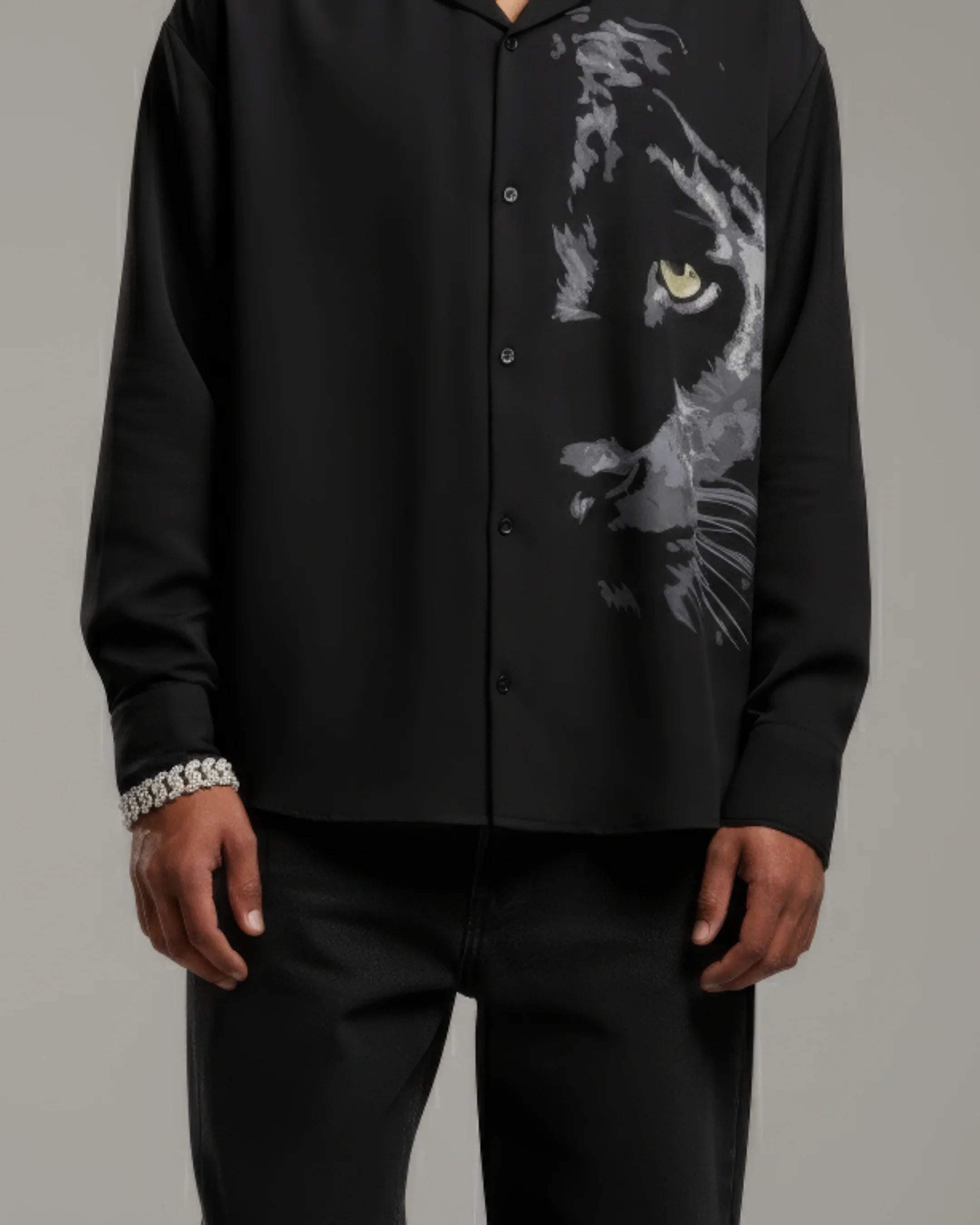 teeside black button-up shirt with artistic panther face print, modeled by man