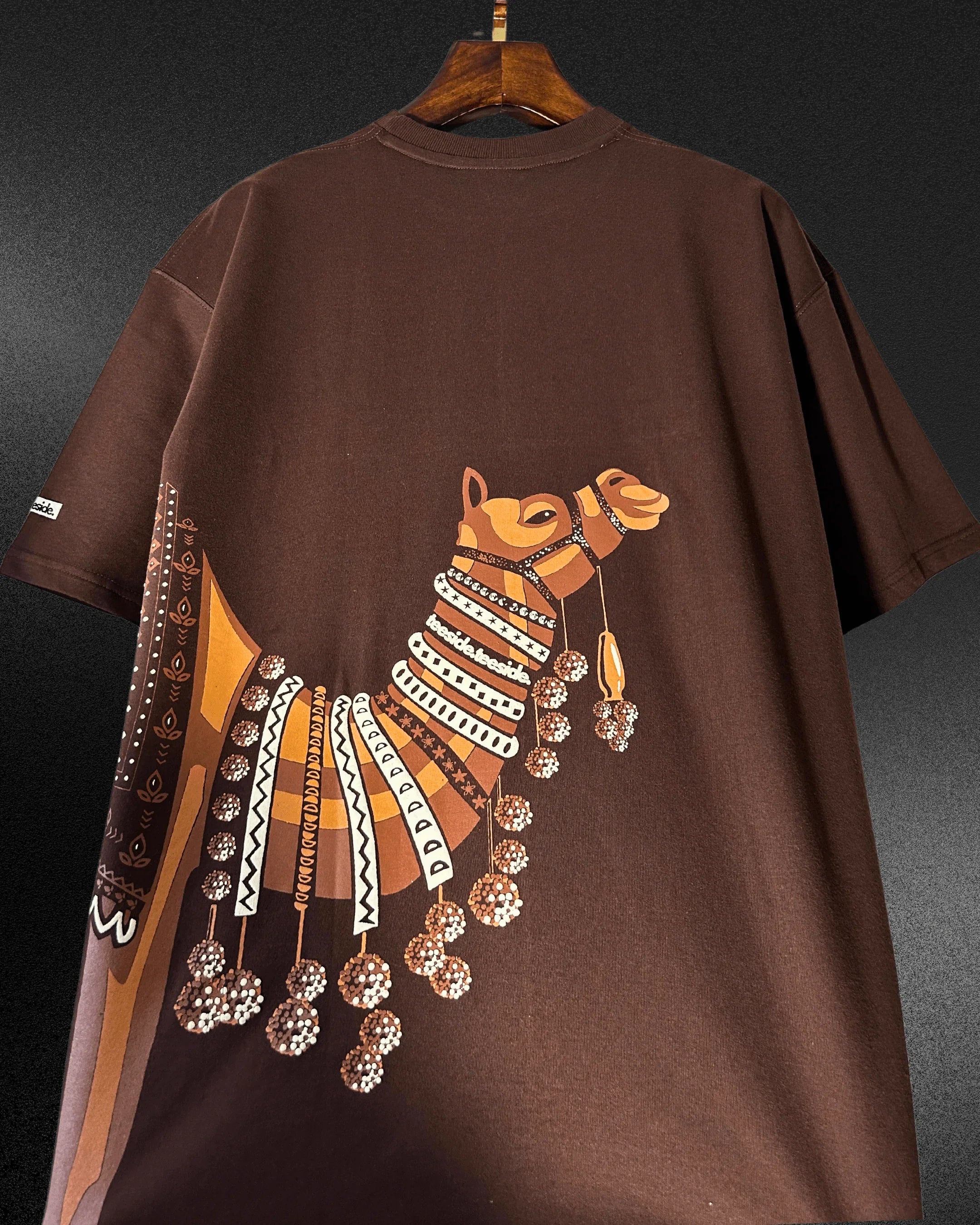 teeside brown t-shirt with artistic camel graphic and decorative patterns on the back