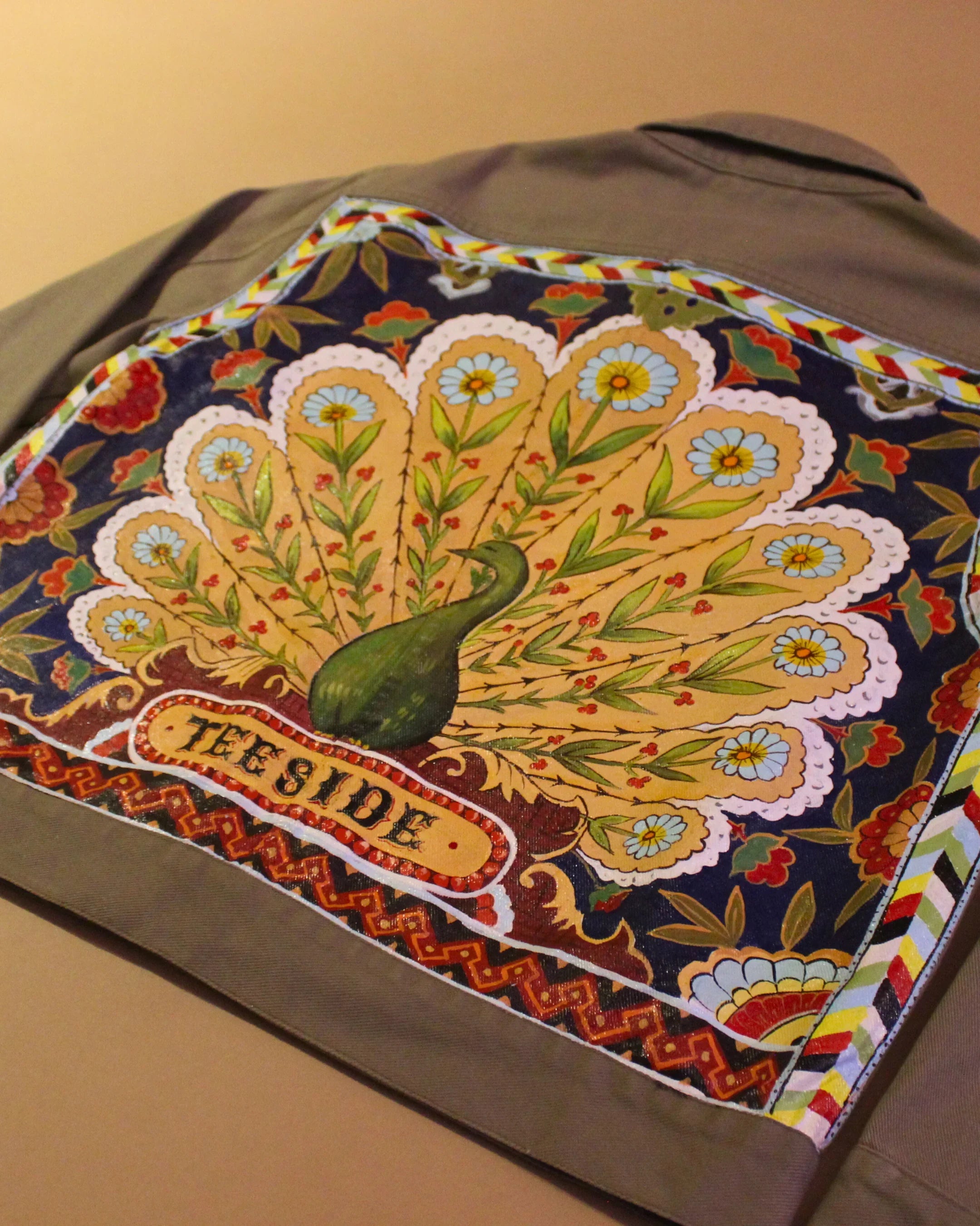 teeside jacket with colorful peacock and floral embroidery on the back