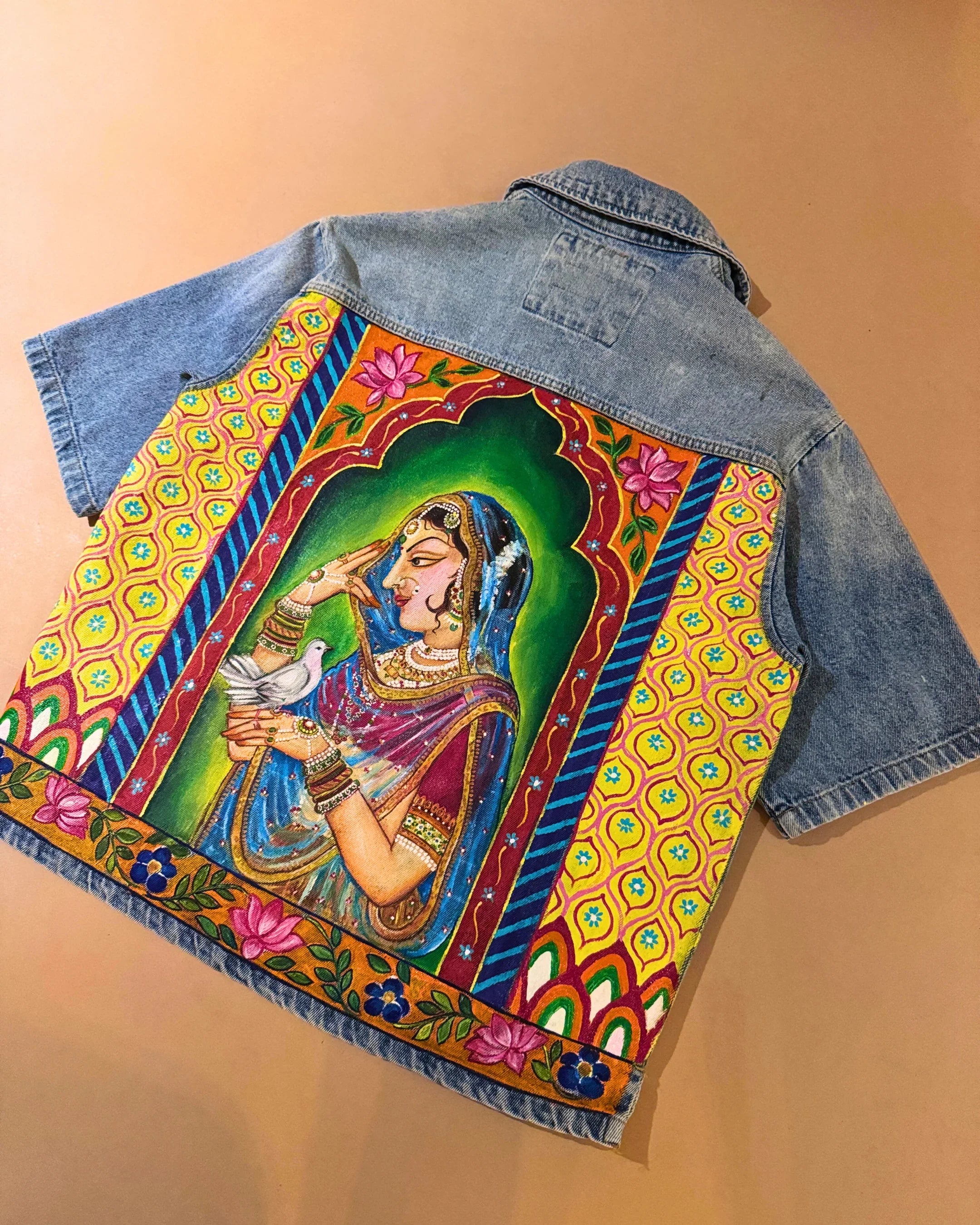 teeside denim jacket with colorful hand-painted Indian woman artwork on the back