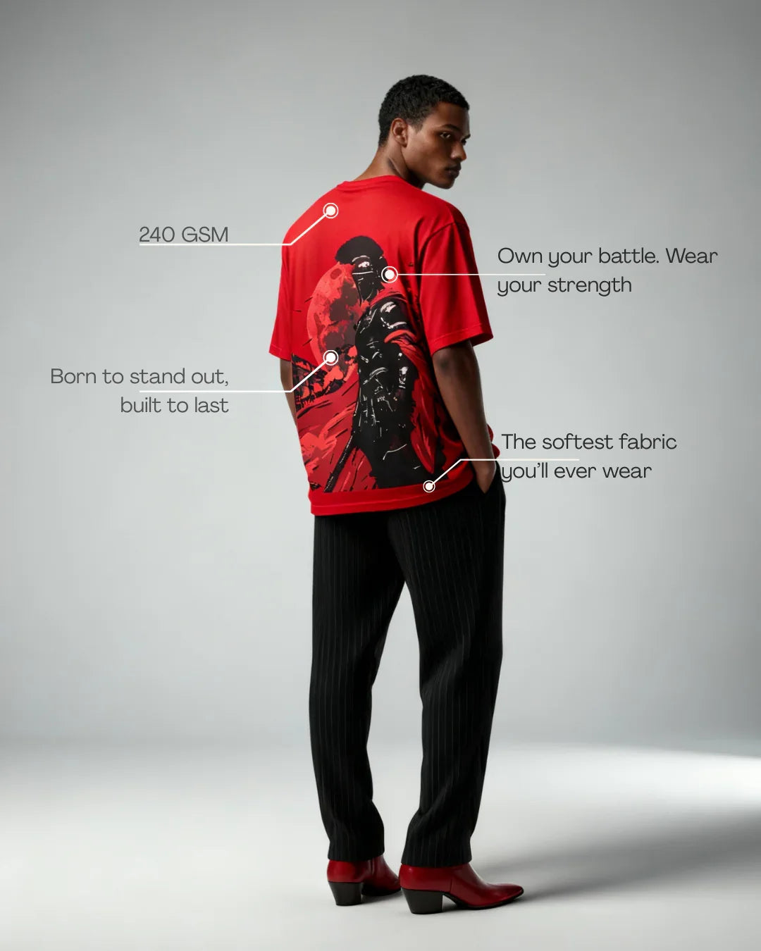 Man modeling a red teeside graphic t-shirt with warrior design and fabric quality highlights