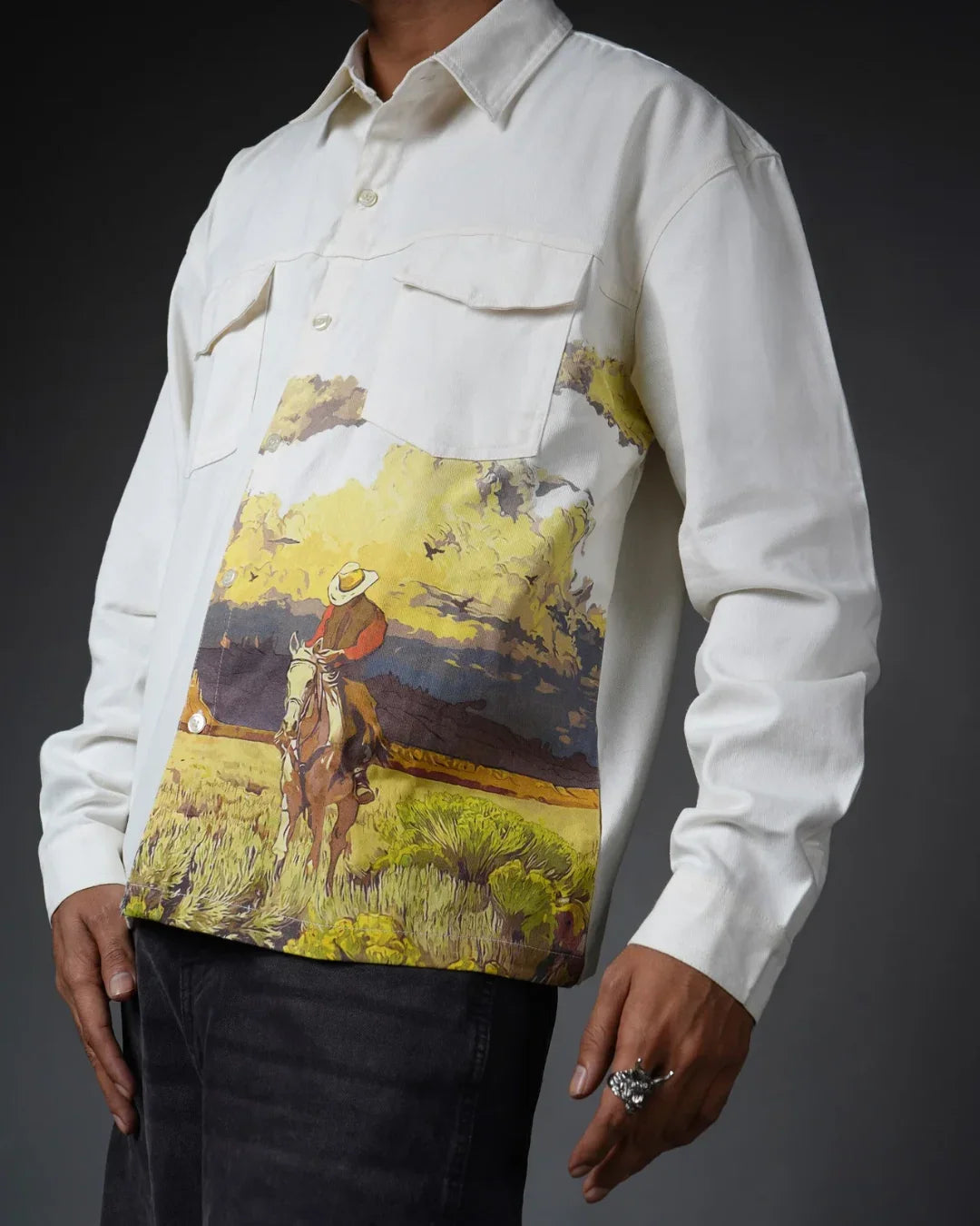 teeside white shirt with cowboy and landscape print, worn by man, artistic western design