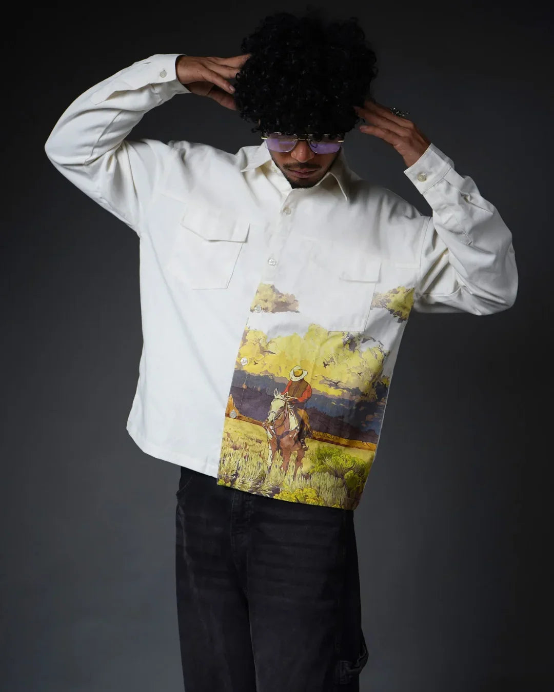teeside white button-up shirt with cowboy landscape print, worn by a model